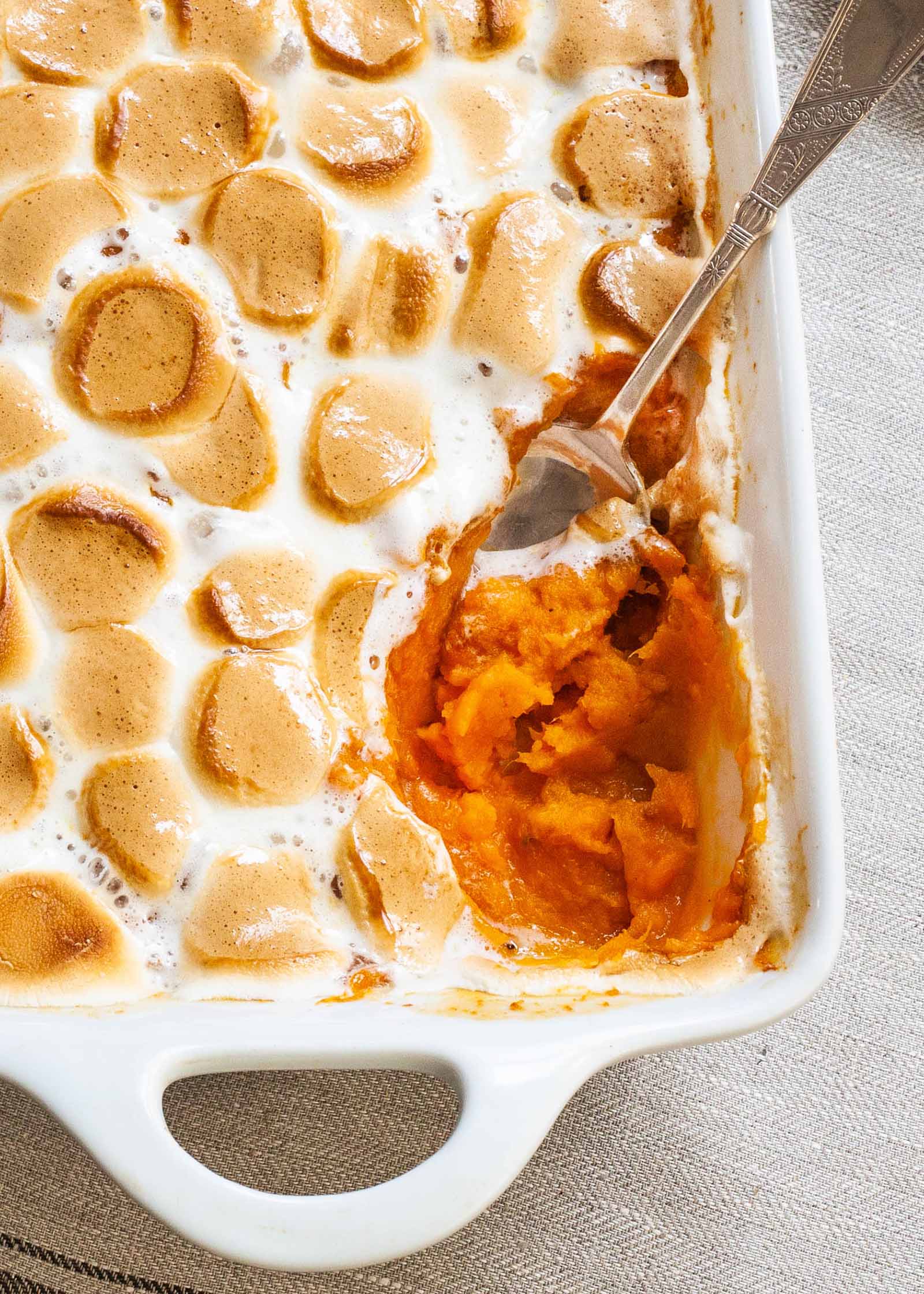 Sweet Potato Casserole Recipe with Marshmallows baked casserole with scoop out of it