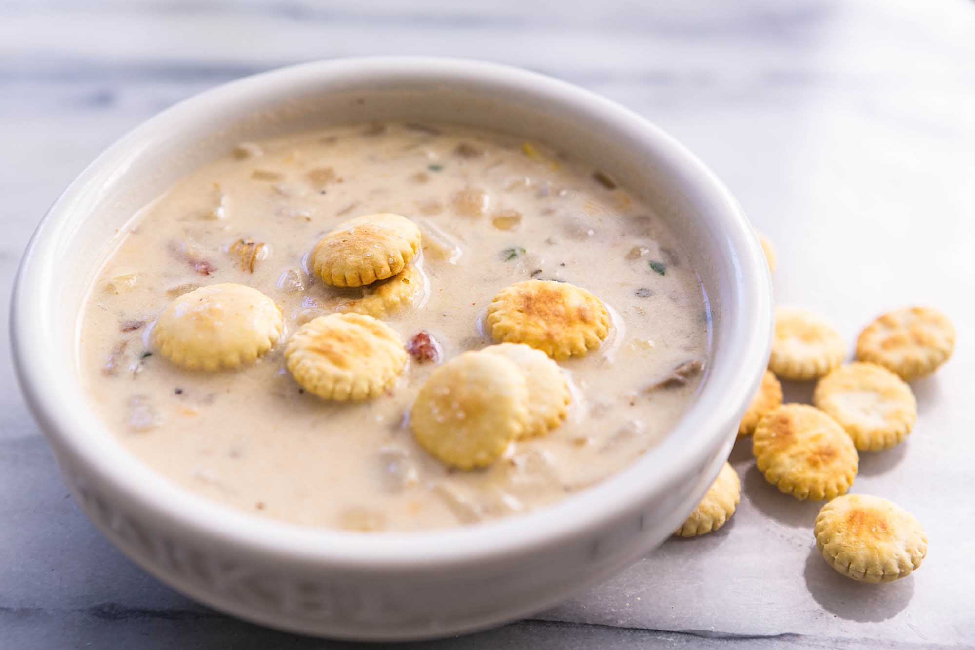 Bowl of New England Clam Chowder with Corn and Oyster Crackers