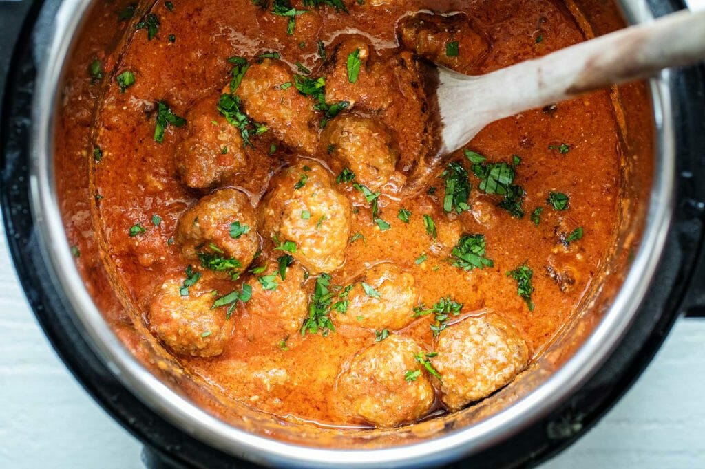 Cheesy slow cooker sausage meatballs cooked in a crockpot