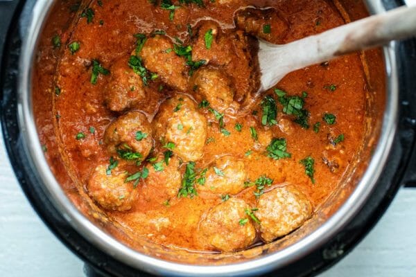 Cheesy slow cooker sausage meatballs cooked in a crockpot