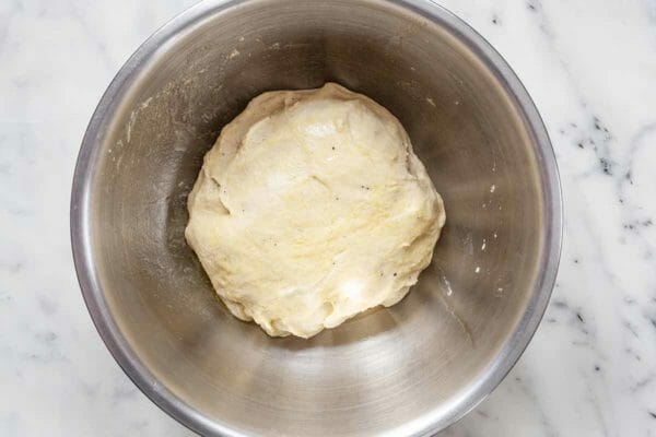 Dough for Stollen in a silver mixing bowl