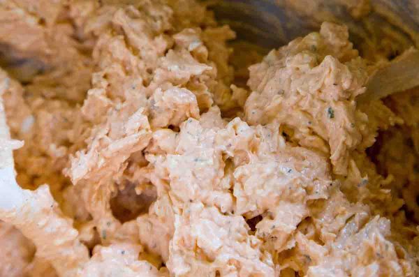Blend the cheese, cream cheese mixture, and chicken together to make the buffalo chicken dip