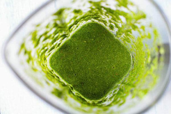 Green chutney made with mint and cilantro for vegetable samosas.