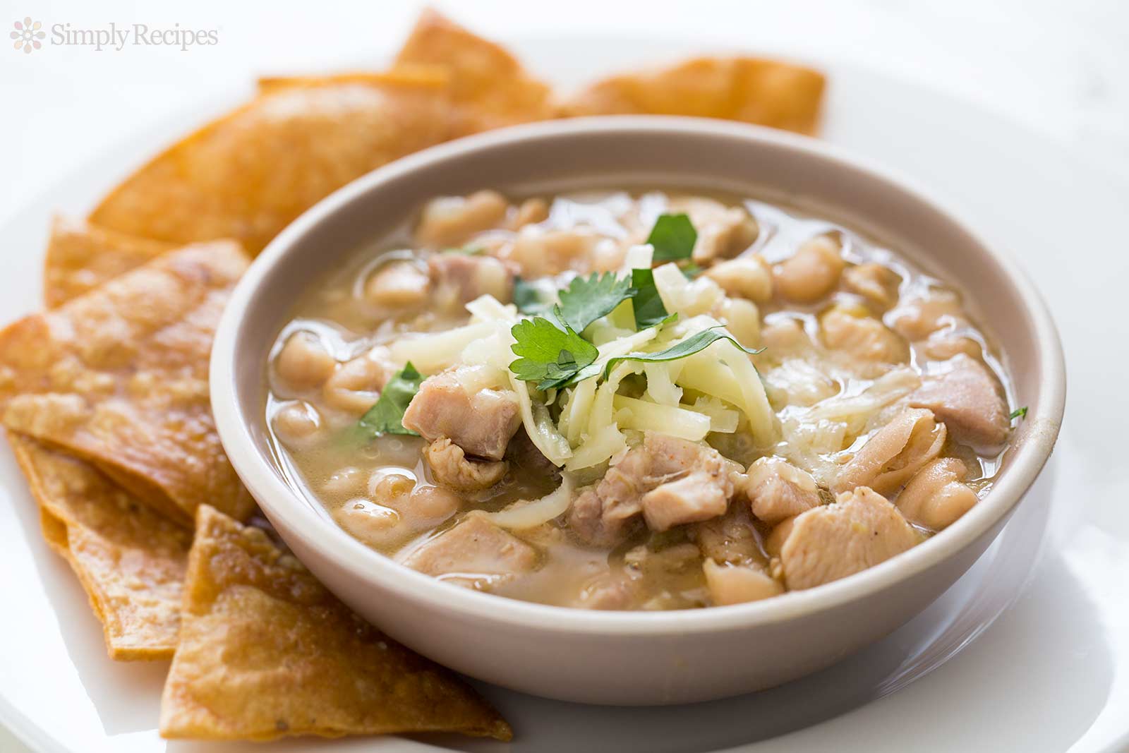 White bean chicken chili in a serving bowl with chips