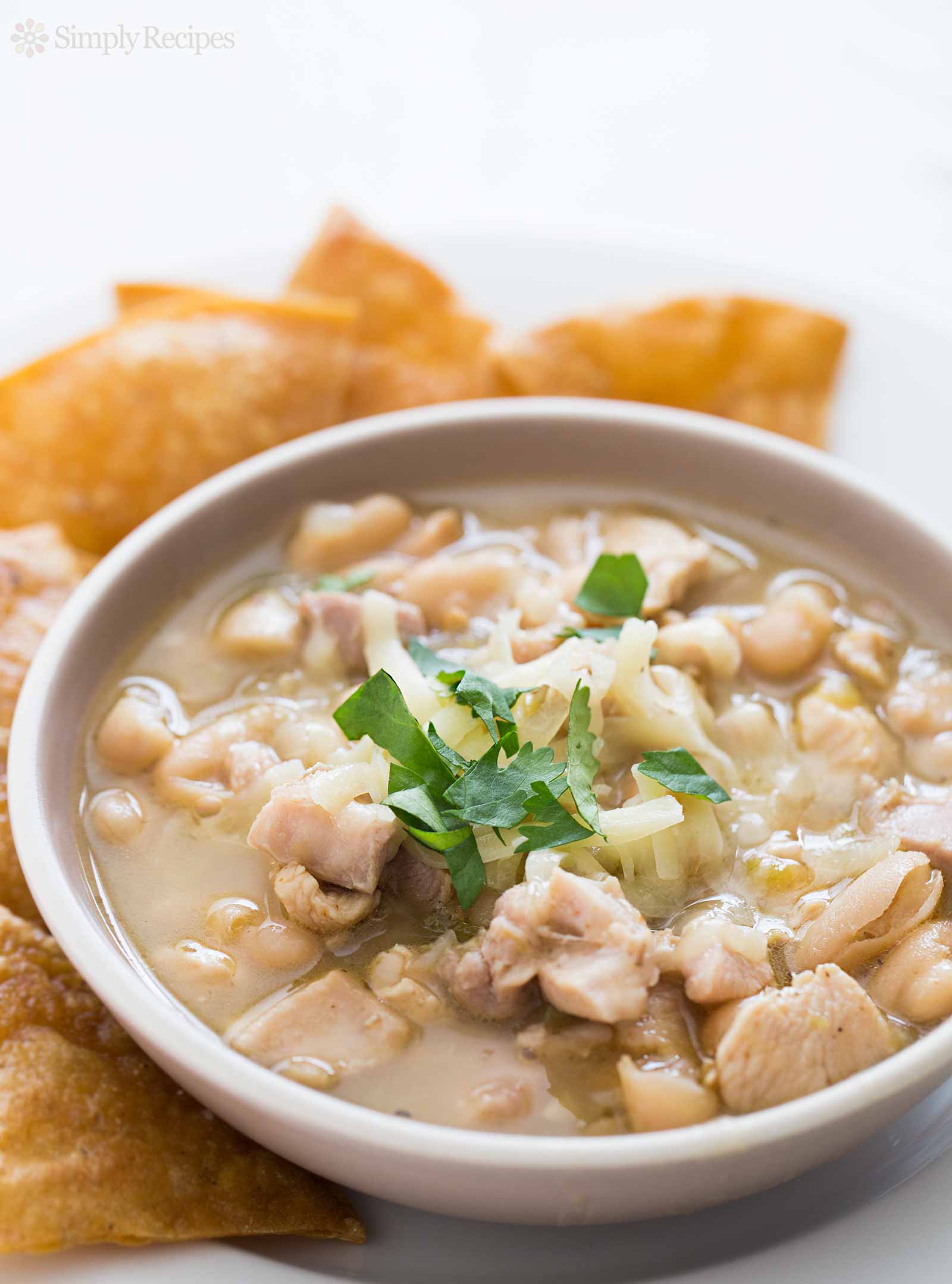 Best White chicken chili in a white serving bowl with chips