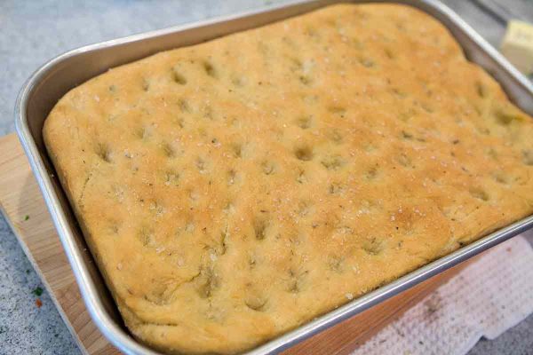 Baked focaccia bread still in the pan
