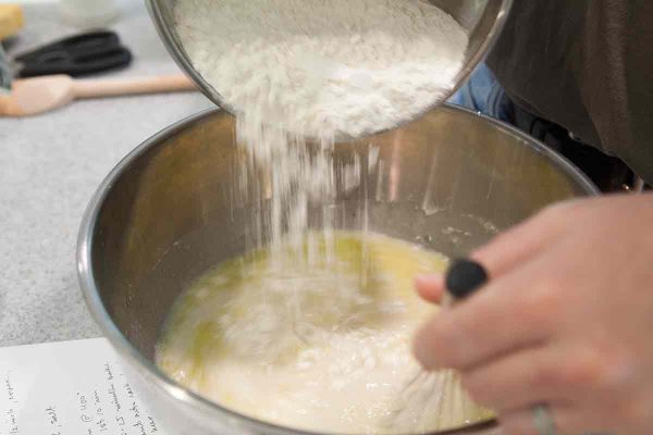 Add some of the flour to the yeast for the focaccia bread