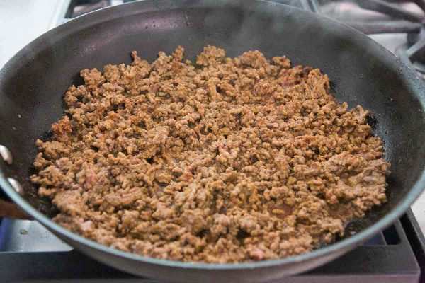 Cook the beef until browned and crumbled