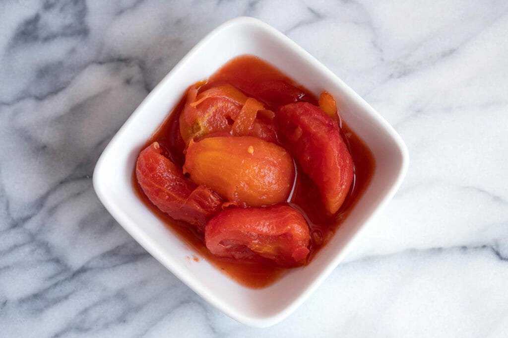 Stewed tomatoes in white bowl