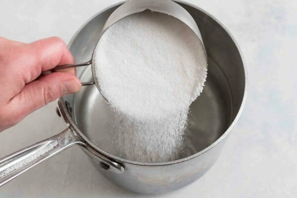 Add the sugar for making kombucha into the water in a medium saucepan