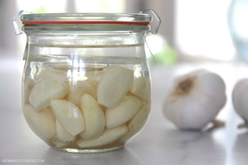 Fermented garlic in jar on counter