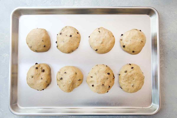 Shaped hot cross buns, risen and ready to go in the oven