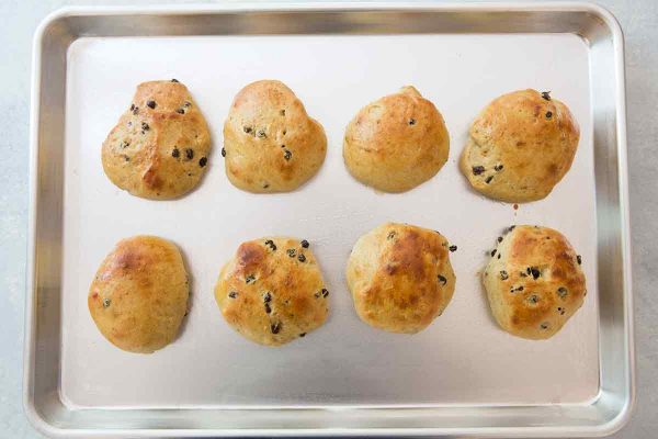 Baked hot cross buns for Easter on a sheet pan