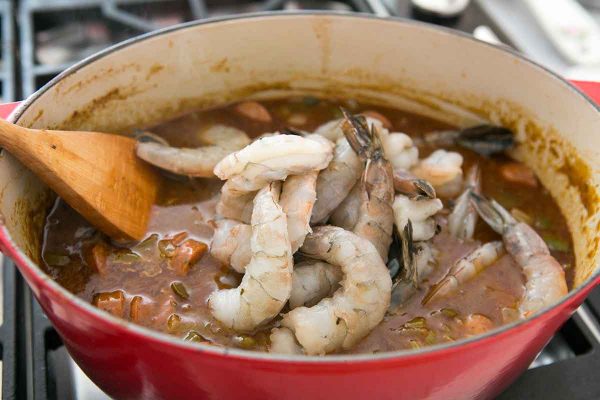 Finally, add the shrimp for the gumbo to the pot with the vegetables and sausage