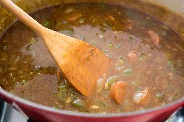Add the sausage to the stew with the vegetables for shrimp gumbo