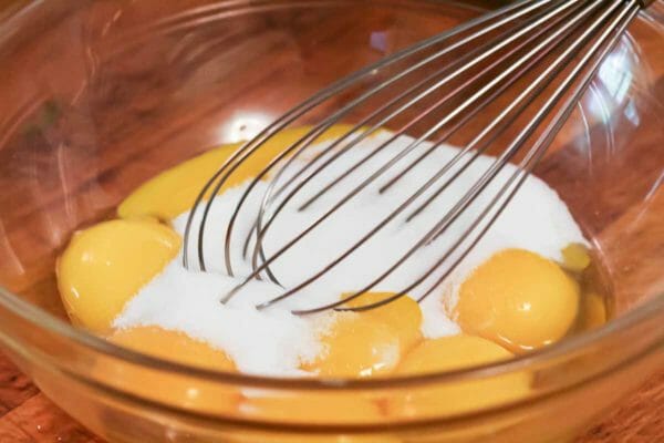 whisk the eggs and sugar together to make the base for vanilla ice cream
