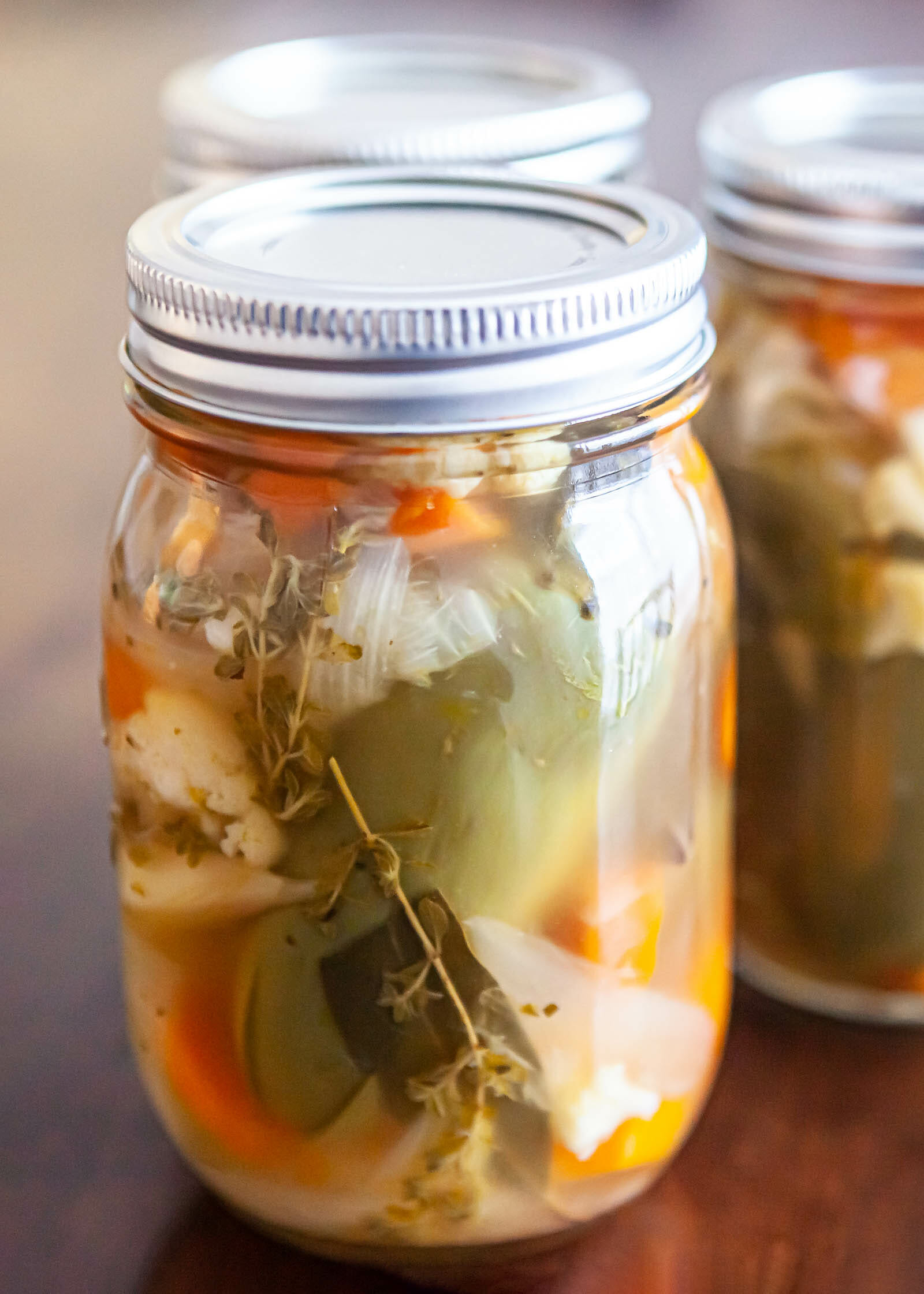 Pickled jalapenos (escabeche) with carrots and cauliflower in a pint jar
