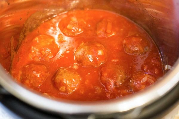 Meatballs with rice in a pressure cooker.